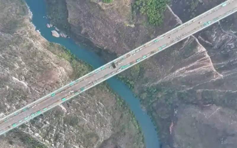 China cut a mountain in half in order to build a highway including the world’s highest bridge